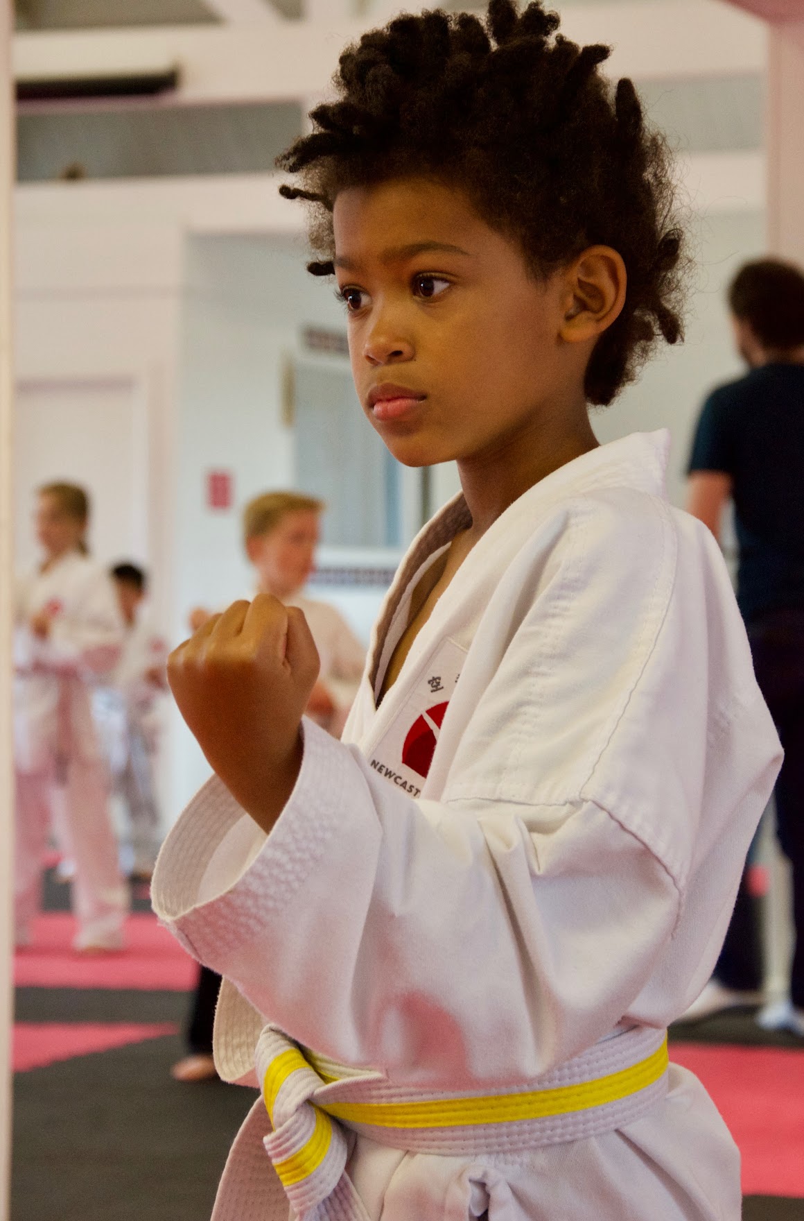 A junior student in stance during class